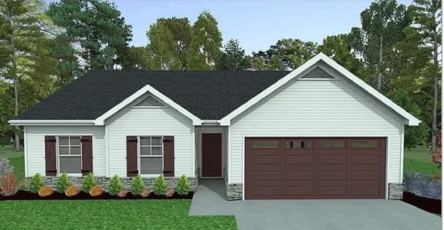 a view of a house with a small yard plants and large tree