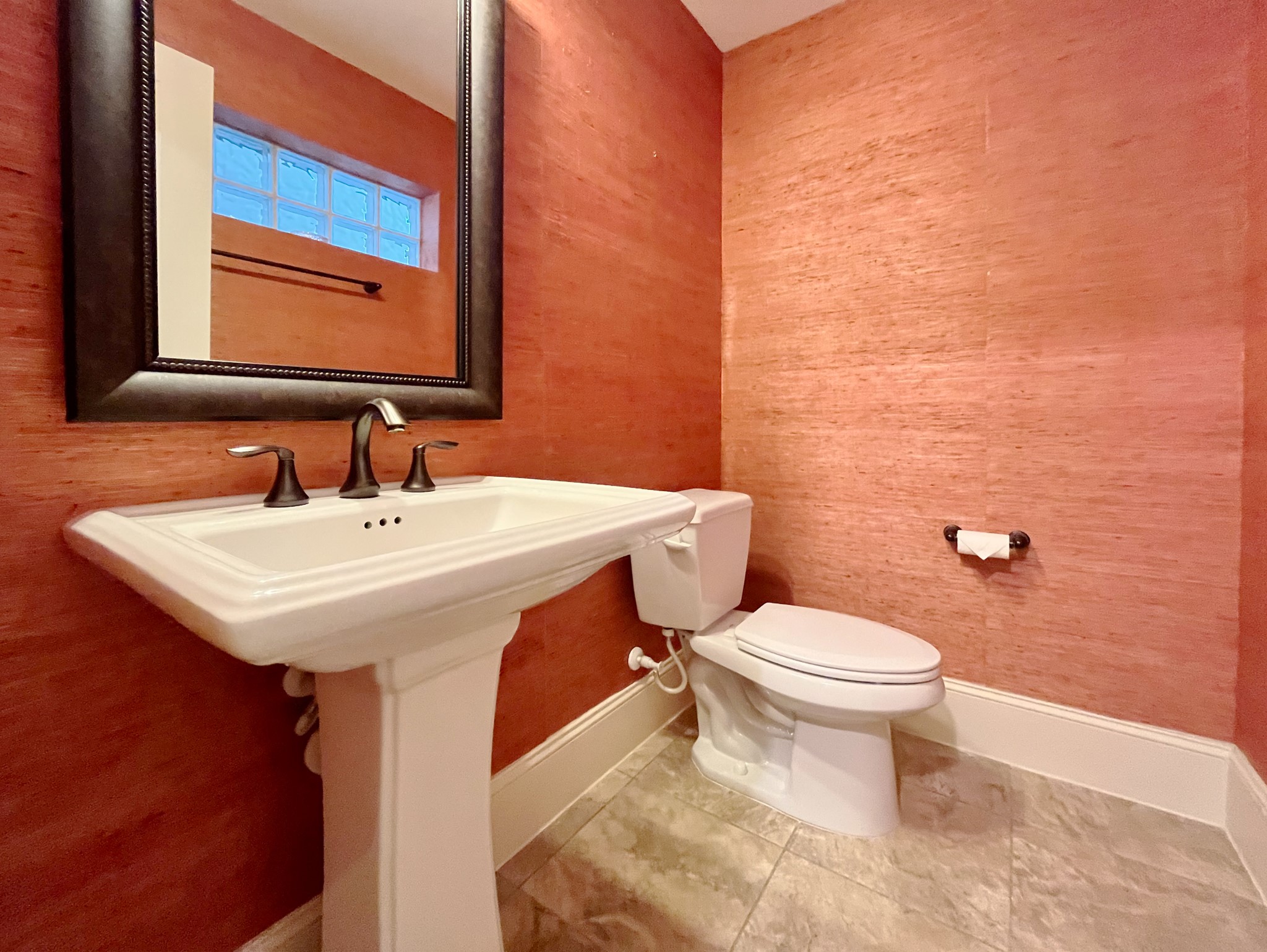 5207 Gibson Street, Unit A Houston, TX 77007 - Photo 13 of 25 half bath on second floor with custom seagrass wallpaper