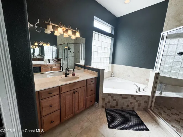 a bathroom with a sink a vanity and a mirror