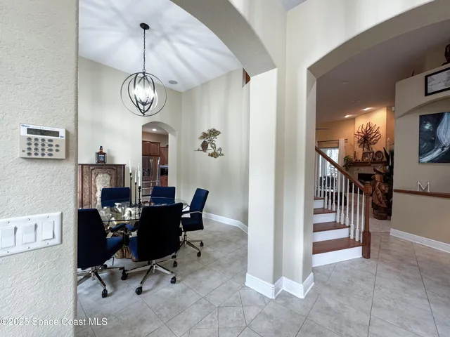 a view of a livingroom with furniture and a window