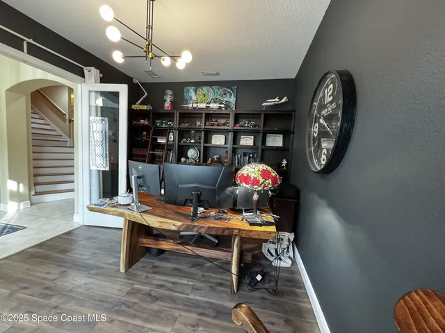 a workspace with furniture and wooden floor