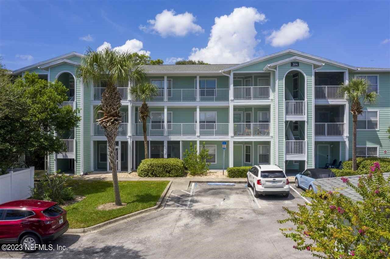 204 16th Street, Unit E St. Augustine, FL 32080 - Photo 1 of 1 a front view of a house with a yard and outdoor seating