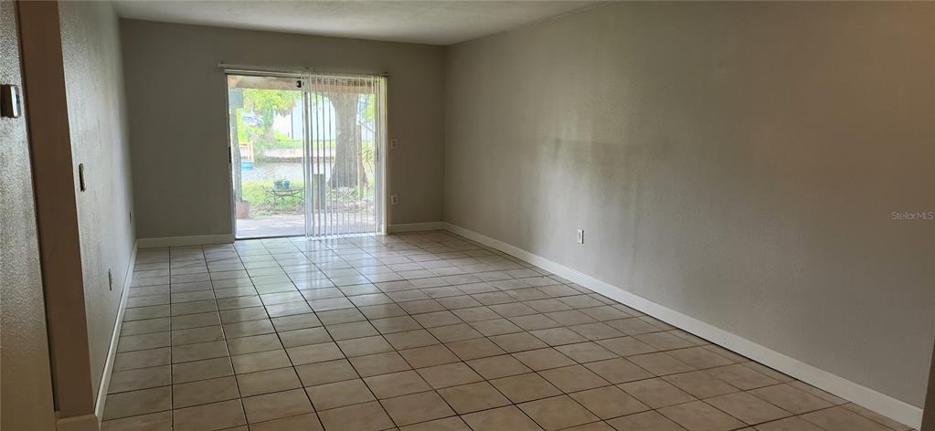 9829 Grace Drive Port Richey, FL 34668 - Photo 5 of 19 a view of an empty room and window