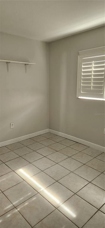 9829 Grace Drive Port Richey, FL 34668 - Photo 10 of 19 a view of a room with an empty space and a window
