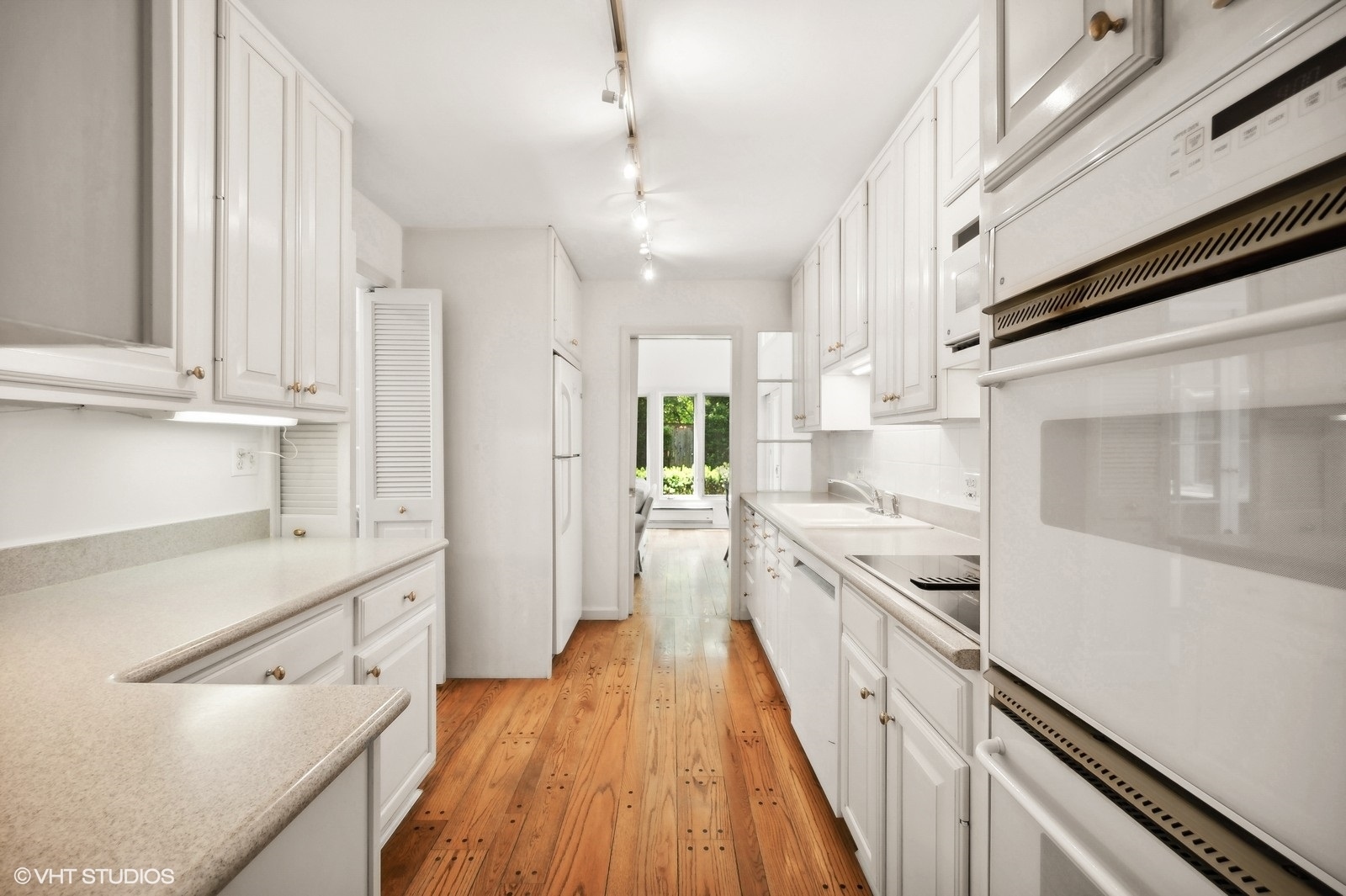 248 Wagner Road Northfield, IL 60093 - Photo 12 of 26 a large white kitchen with stainless steel appliances