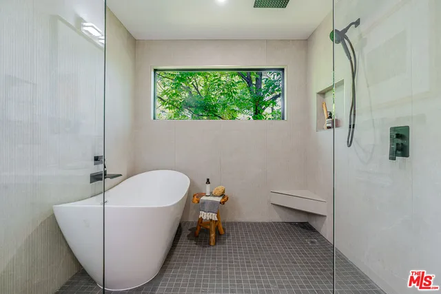 a bathroom with a bathtub and a window