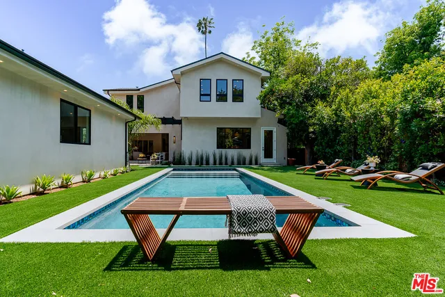 a house with garden in front of it