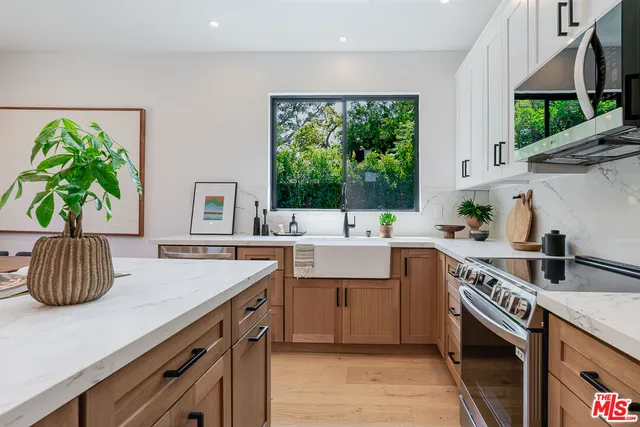 a kitchen with a sink and a stove