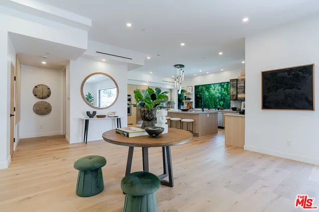 a kitchen with a table and chairs in it