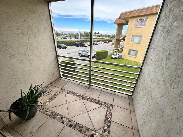 a view of a balcony with chairs