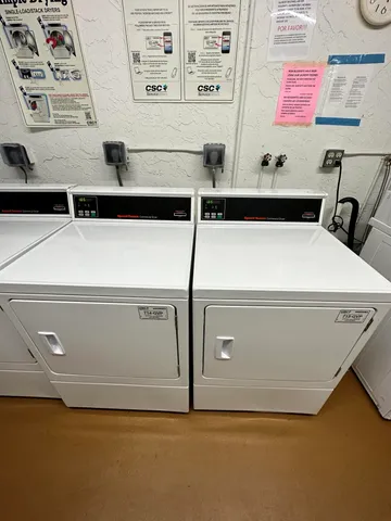 a utility room with washer and dryer