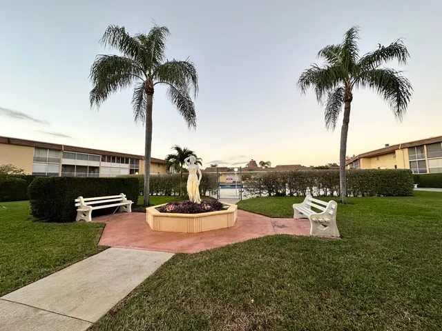 a view of a yard with a table and chairs