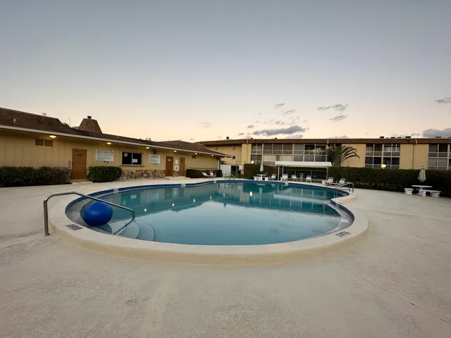 a view of a livingroom with furniture and a flat screen tv