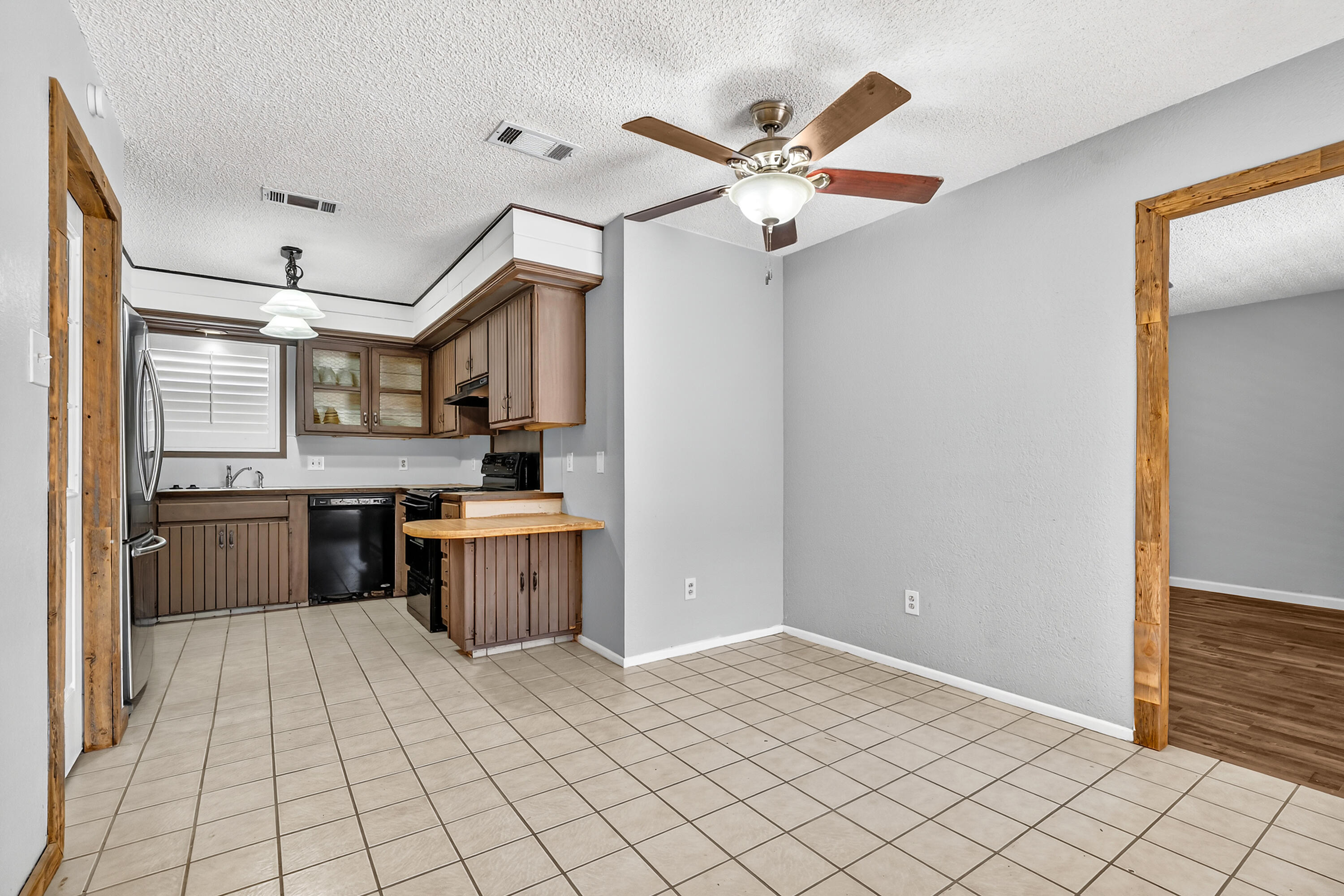 5236 91st Street Lubbock, TX 79424 - Photo 7 of 23 a open kitchen with a sink cabinets and stainless steel appliances