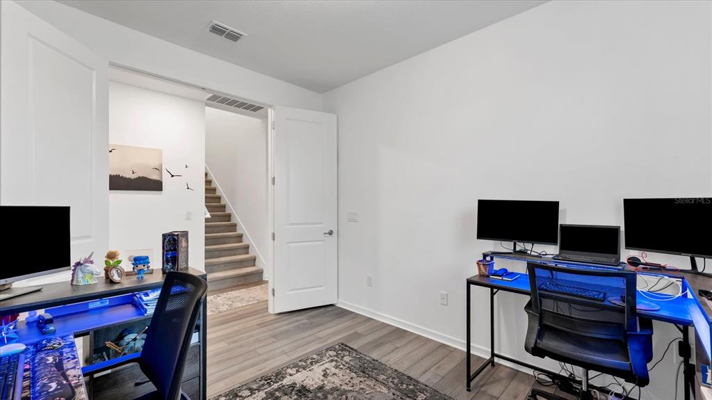 8705 Coastal Key Way Palmetto, FL 34221 - Photo 22 of 64 a view of a workspace with furniture and a window