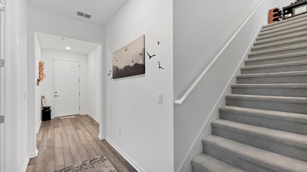 8705 Coastal Key Way Palmetto, FL 34221 - Photo 28 of 68 a view of entryway with wooden floor