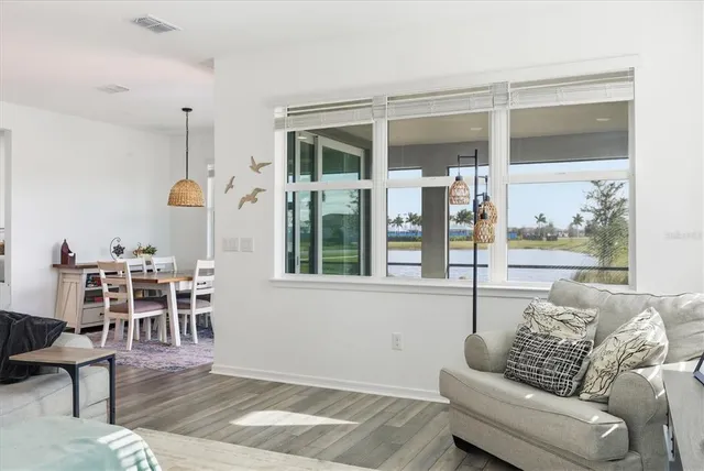 a view of a dining room with furniture and window