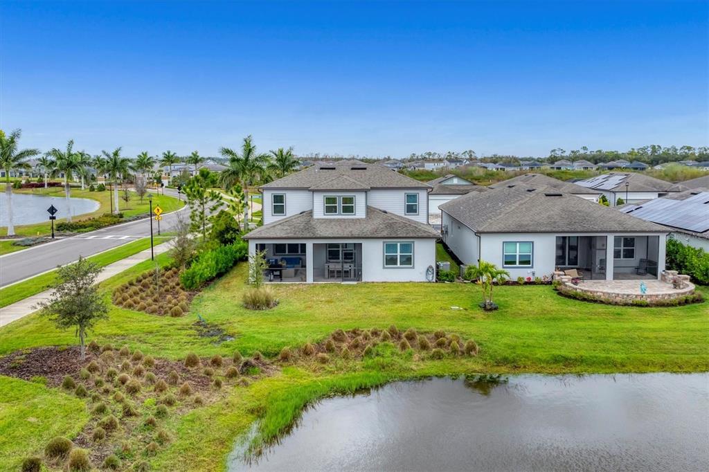 8705 Coastal Key Way Palmetto, FL 34221 - Photo 33 of 64 a front view of a house with garden