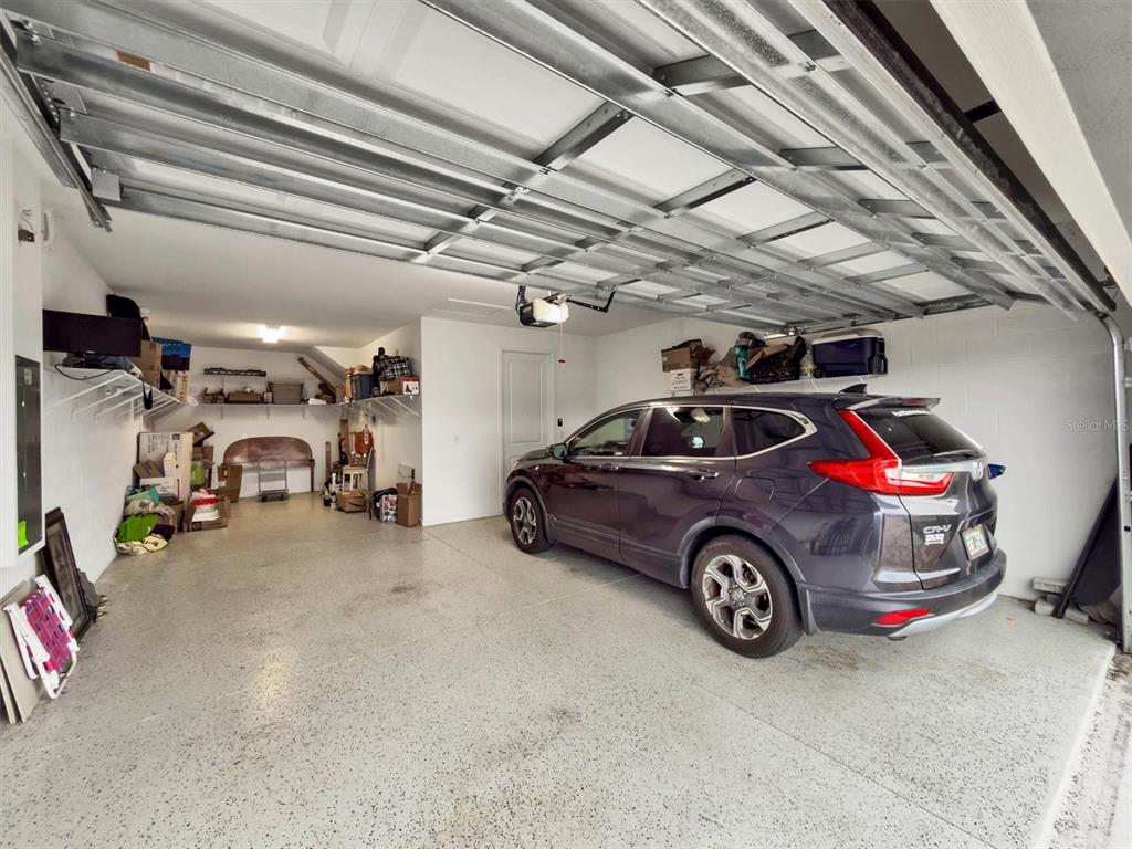 8705 Coastal Key Way Palmetto, FL 34221 - Photo 35 of 68 a view of parking garage with cars and other equipment