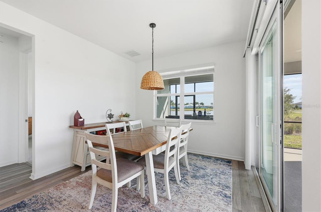 8705 Coastal Key Way Palmetto, FL 34221 - Photo 5 of 68 a view of a dining room with furniture and window