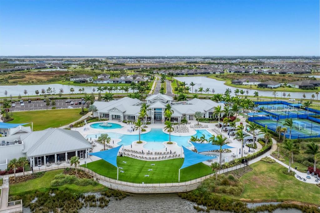 8705 Coastal Key Way Palmetto, FL 34221 - Photo 64 of 64 an aerial view of residential houses with outdoor space and swimming pool