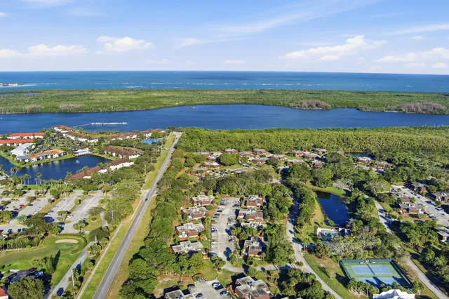 a view of deck with seating and trees