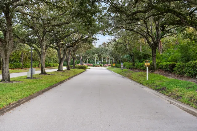 a patio with a table and chairs under an umbrella