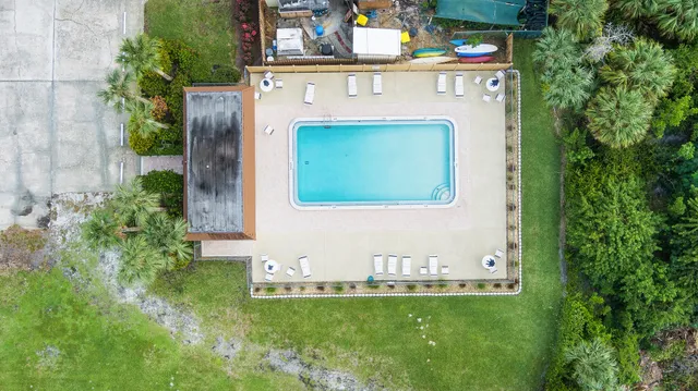an aerial view of a house with garden