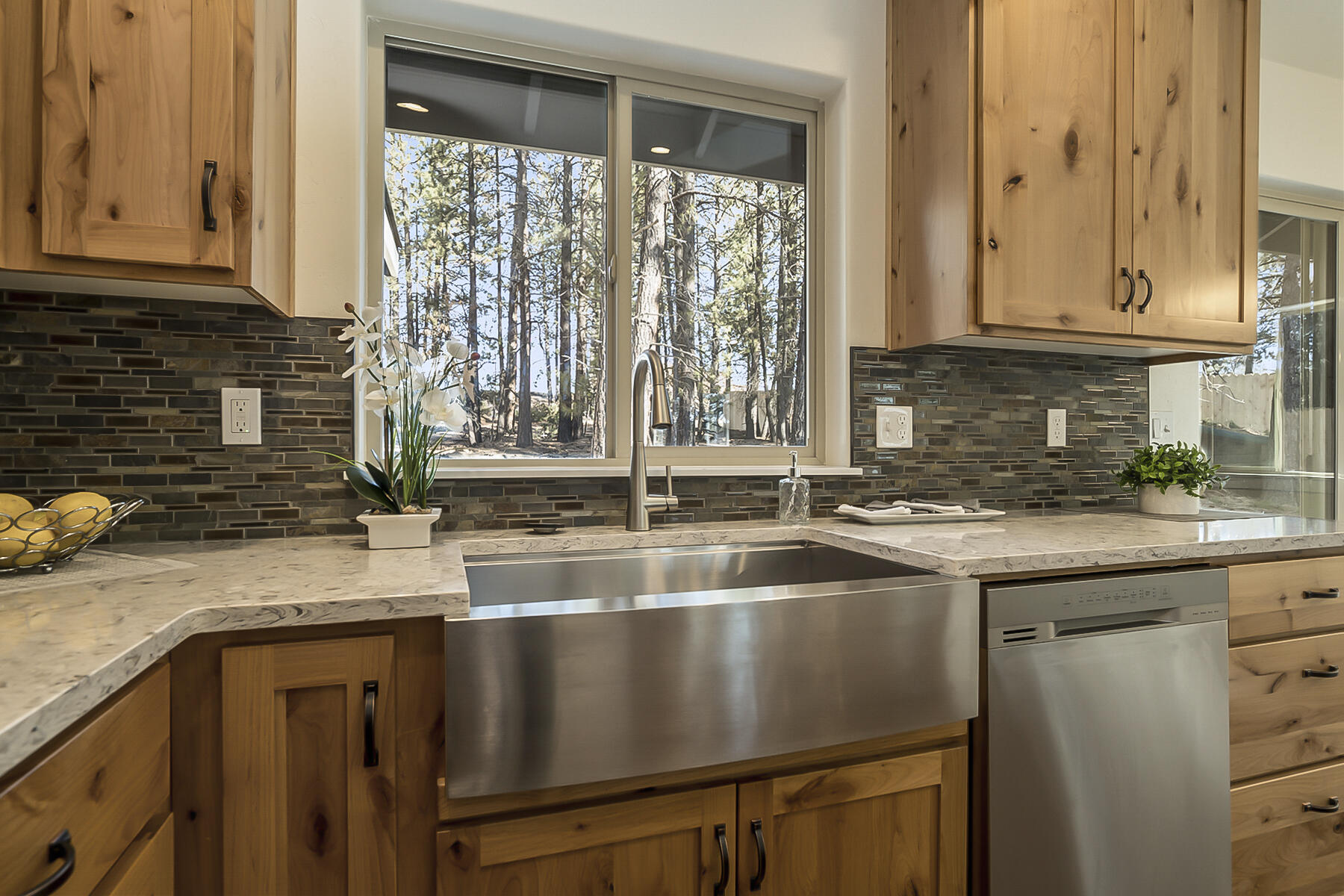 19220 Cherokee Road Bend, OR 97702 - Photo 3 of 25 a kitchen with granite countertop a sink and a window