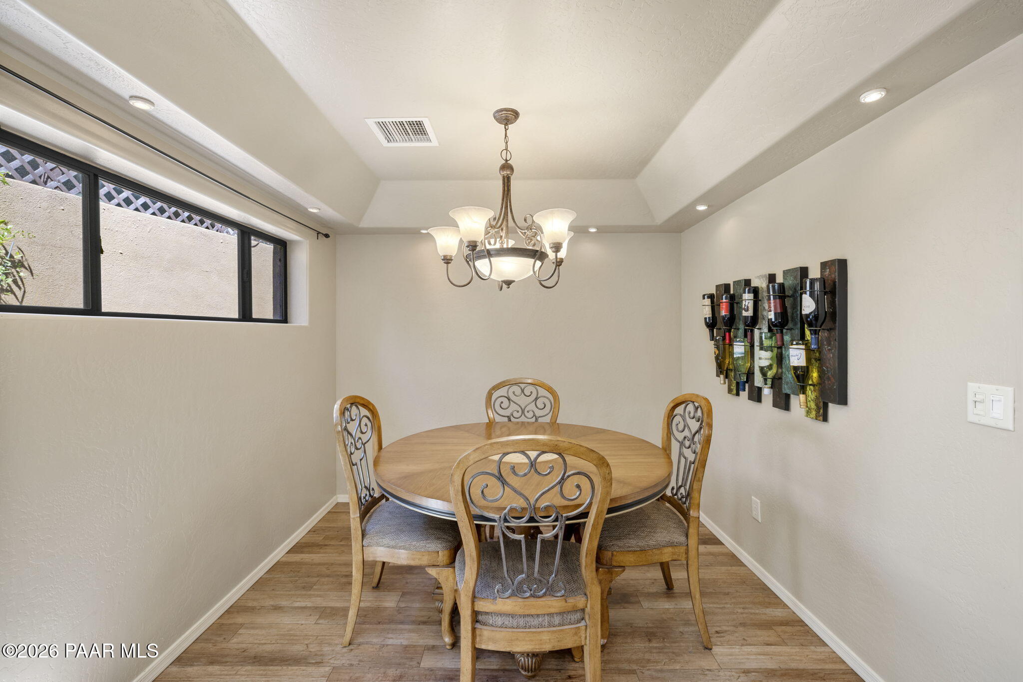 535 Copper Basin Road Prescott, AZ 86303 - Photo 17 of 41 a view of a dining room with furniture and chandelier