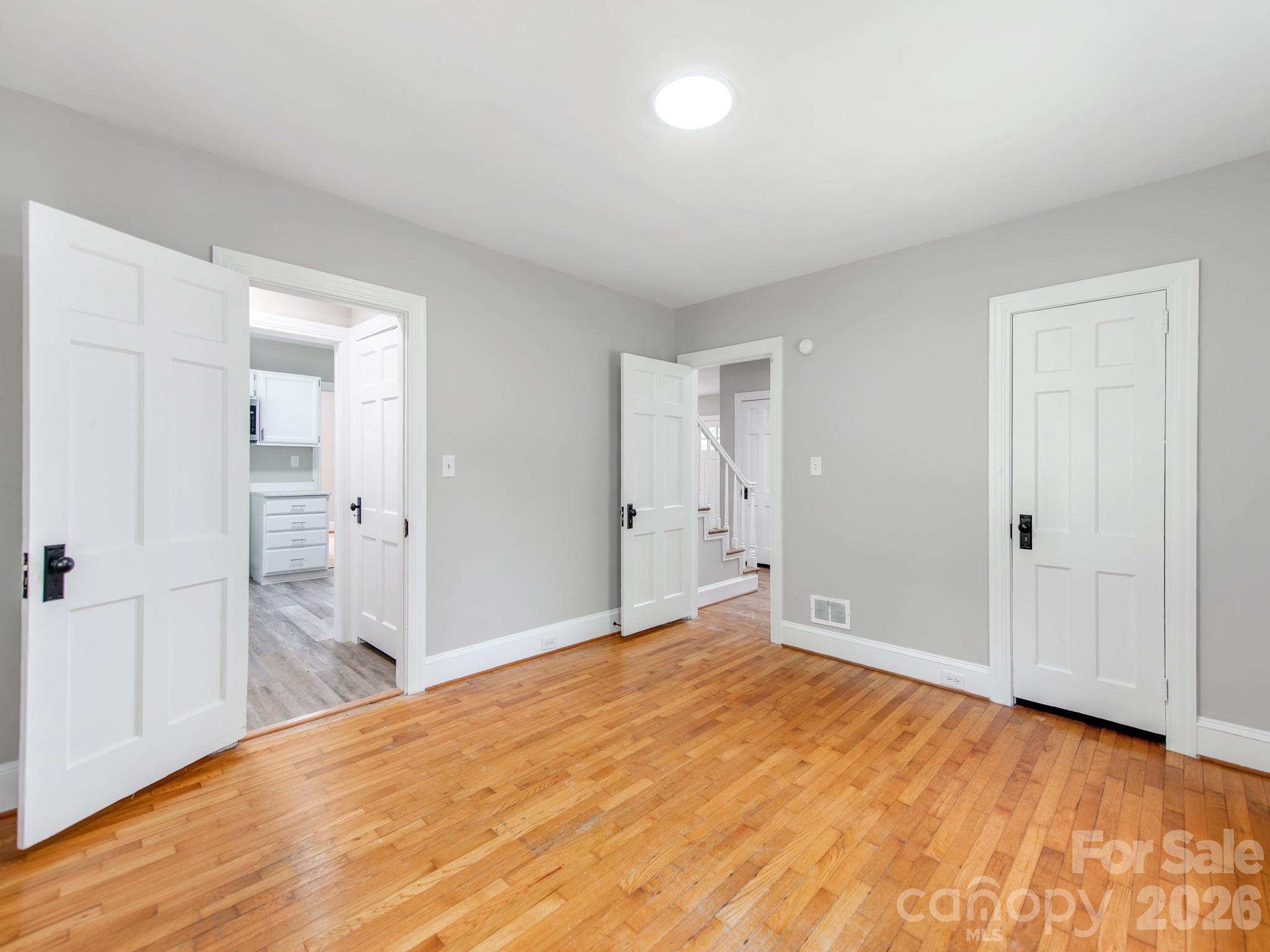 113 Falls Street Morganton, NC 28655 - Photo 12 of 33 a view of empty room with wooden floor