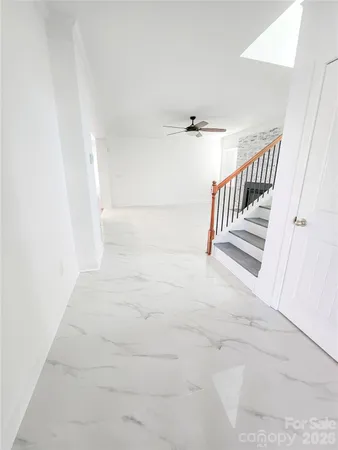 a view of a hallway with staircase