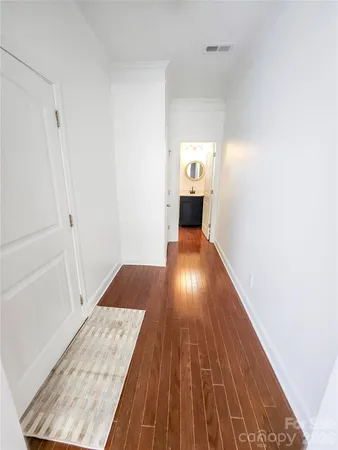 a bathroom with a sink toilet and a mirror
