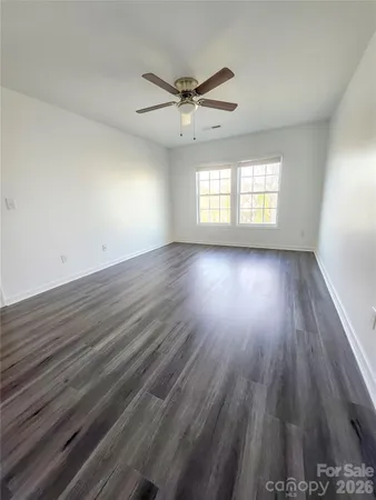 a view of room window and wooden floor