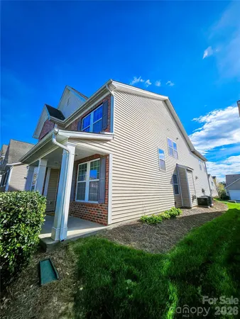 a view of front of house with a yard