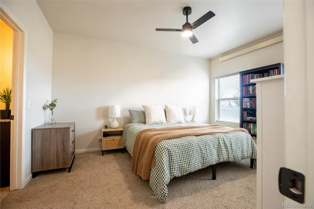 a bedroom with bed and a window