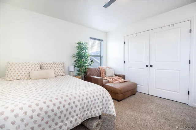 a living room with furniture a couch and a stove