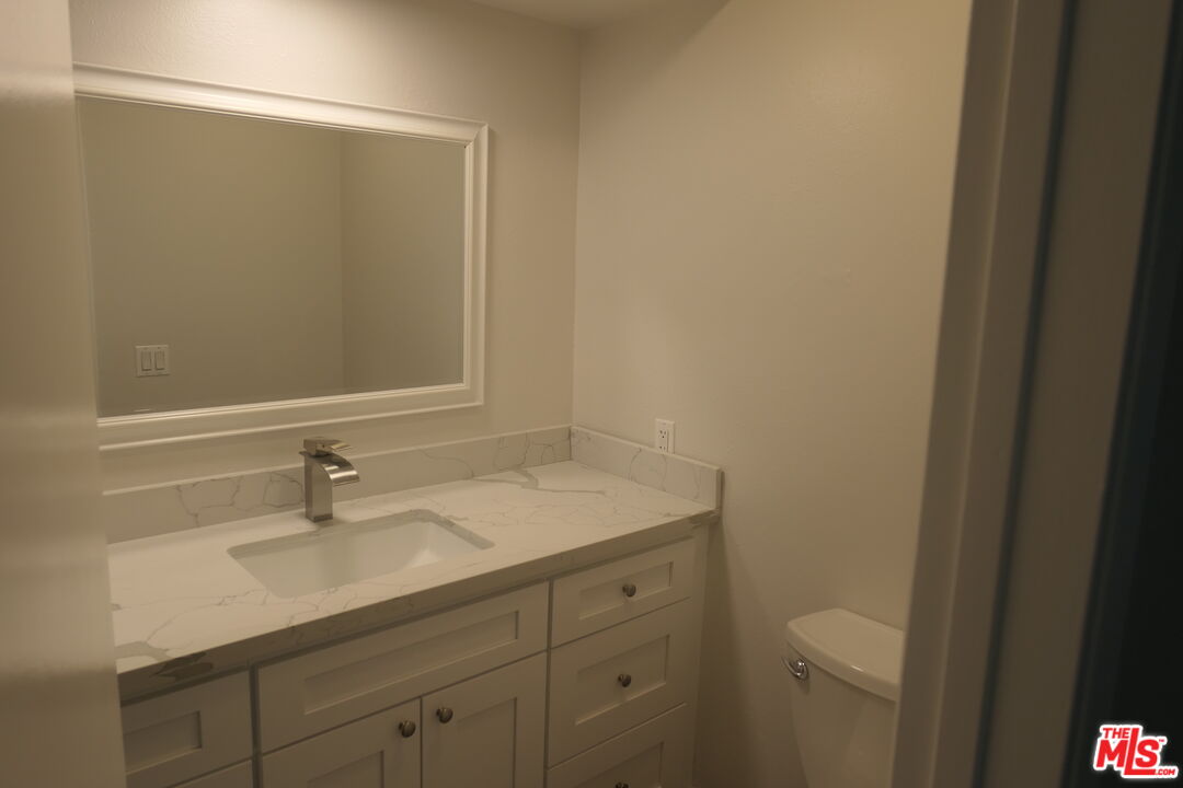 10836 Camarillo Street, Unit 3 North Hollywood, CA 91602 - Photo 10 of 12 a bathroom with a sink and a mirror