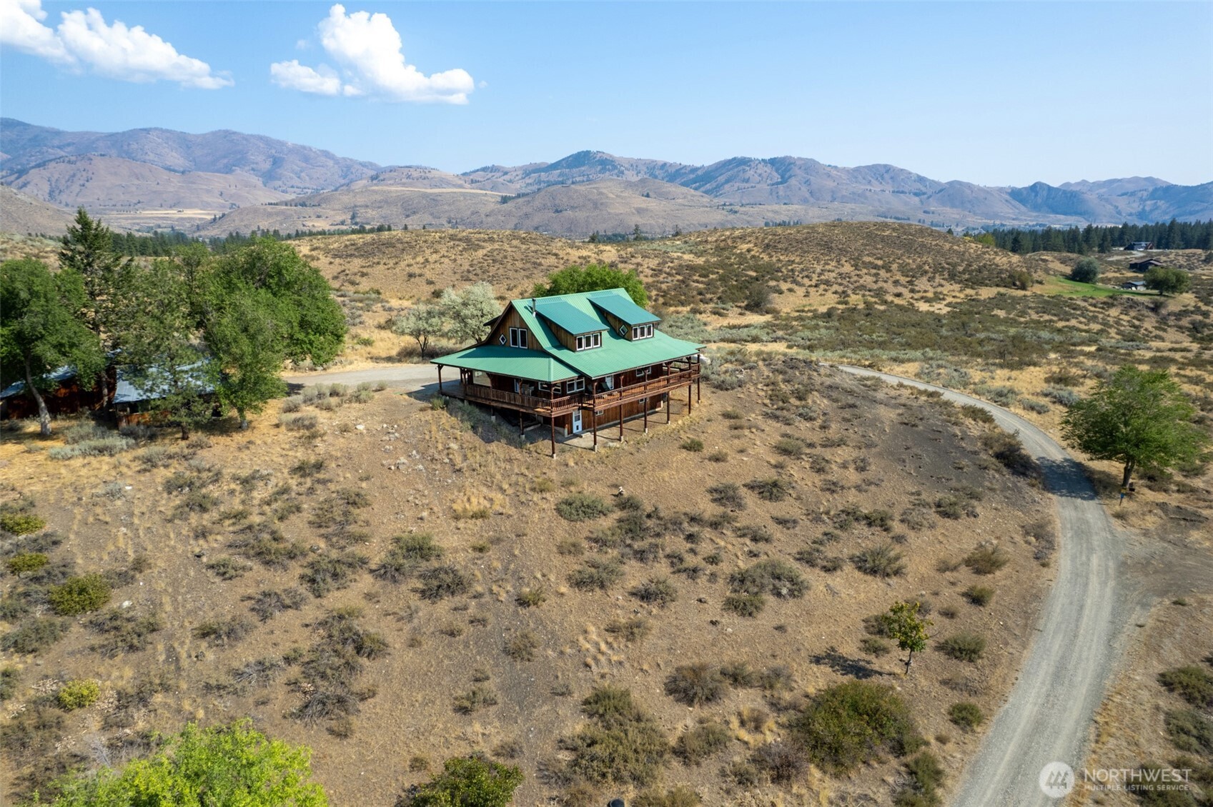 13 Serviceberry Road Winthrop, WA 98862 - Photo 38 of 40 a view of a lake with a mountain