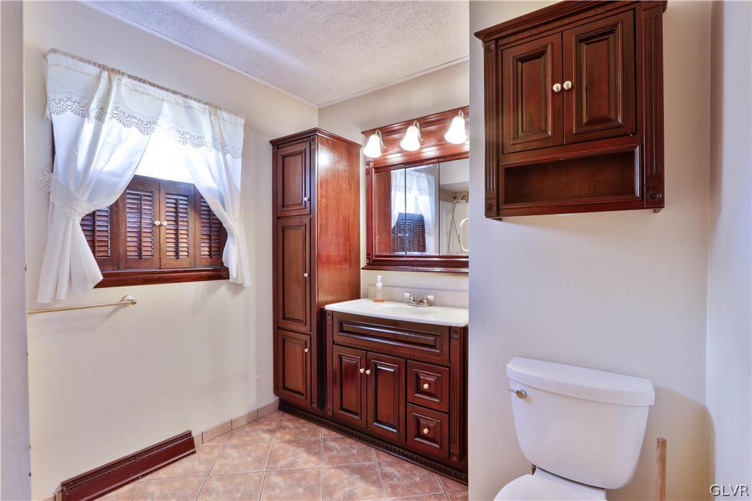 481 Henry Road Nazareth, PA 18064 - Photo 15 of 35 a bathroom with a toilet a sink and mirror