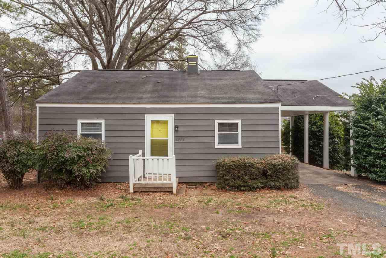 1213 Kent Road Raleigh, NC 27606 - Photo 1 of 6 a front view of a house with garden