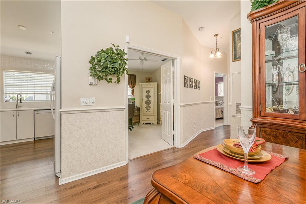 367 Dover Place, Unit 1006 Naples, FL 34104 - Photo 14 of 31 a living room with furniture and a table