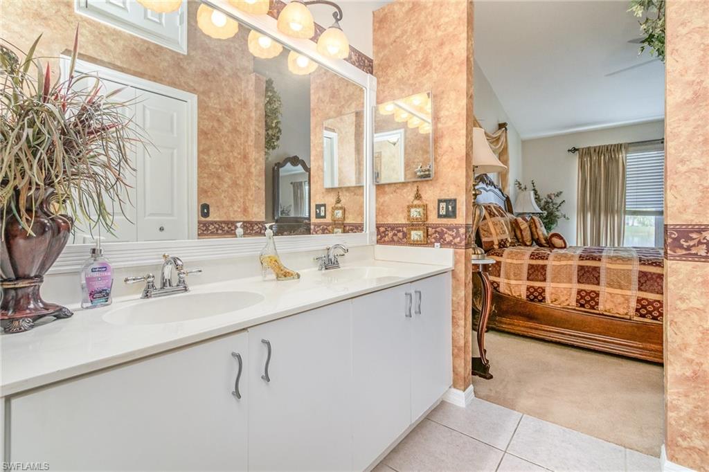 367 Dover Place, Unit 1006 Naples, FL 34104 - Photo 20 of 31 a view of a double vanity sink and a window