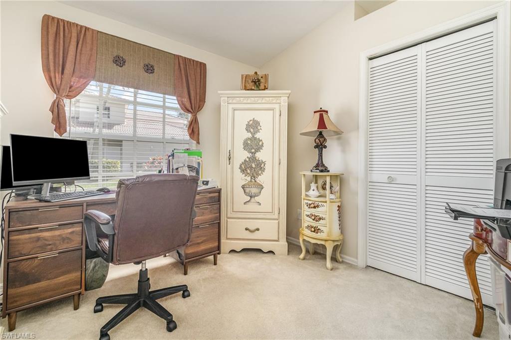 367 Dover Place, Unit 1006 Naples, FL 34104 - Photo 24 of 31 a view of a workspace with furniture and a window