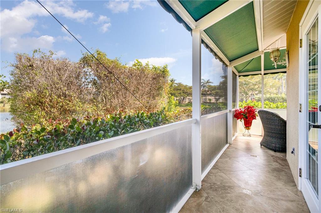 367 Dover Place, Unit 1006 Naples, FL 34104 - Photo 30 of 31 a view of a balcony with wooden floor