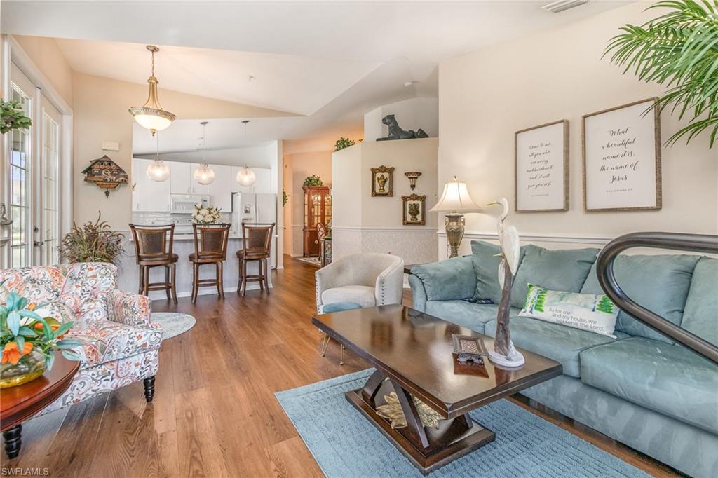 367 Dover Place, Unit 1006 Naples, FL 34104 - Photo 6 of 31 a living room with furniture