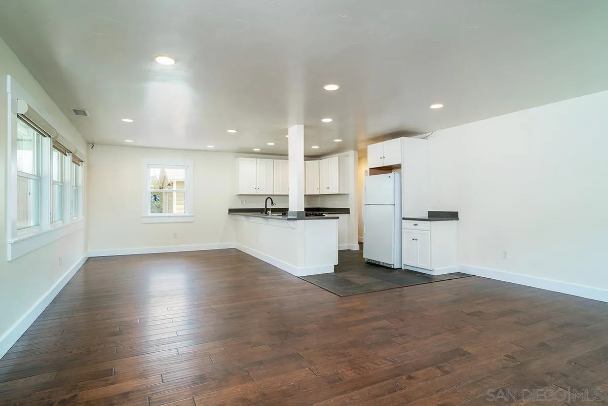 6777 West Lilac Road Bonsall, CA 92003 - Photo 12 of 36 a view of kitchen with wooden floor and electronic appliances