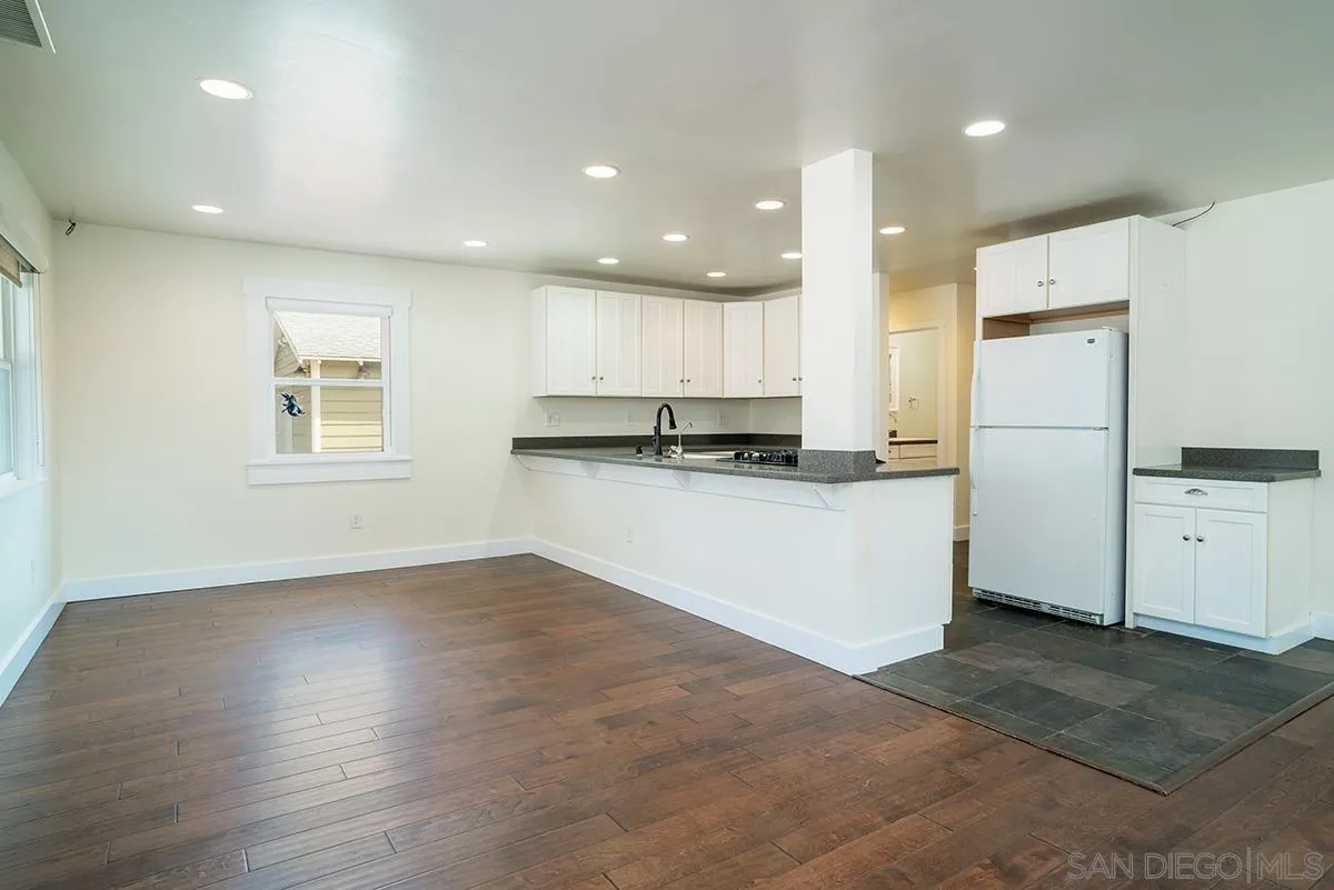 6777 West Lilac Road Bonsall, CA 92003 - Photo 16 of 36 a kitchen with stainless steel appliances granite countertop a refrigerator and a stove top oven