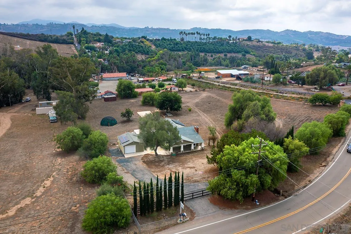 6777 West Lilac Road Bonsall, CA 92003 - Photo 2 of 36 an aerial view of a town with couple of houses