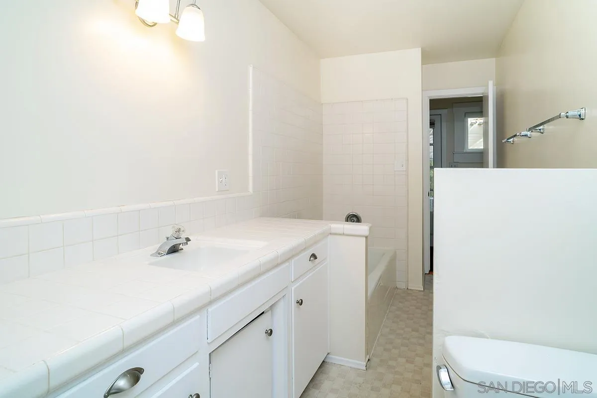 6777 West Lilac Road Bonsall, CA 92003 - Photo 24 of 36 a bathroom with a sink a toilet and shower
